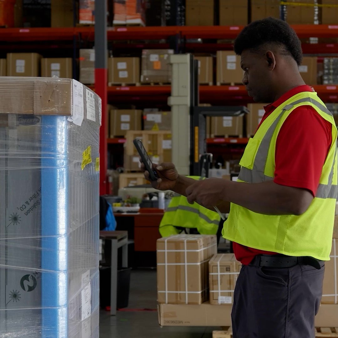 Warehouseman Scanning Barcode